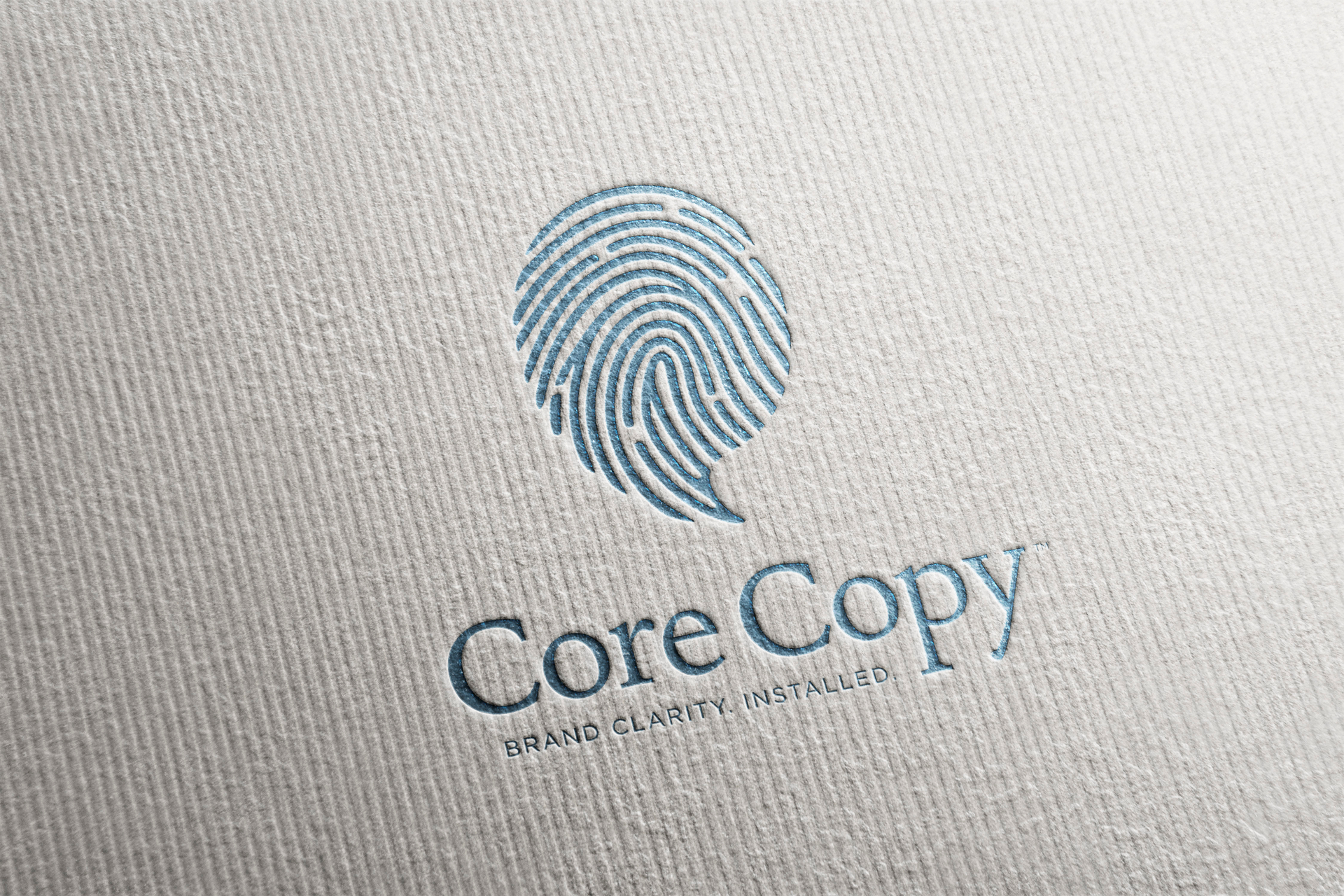 Detail: Core Copy fingerprint mark, letterpressed in teal on cotton stock